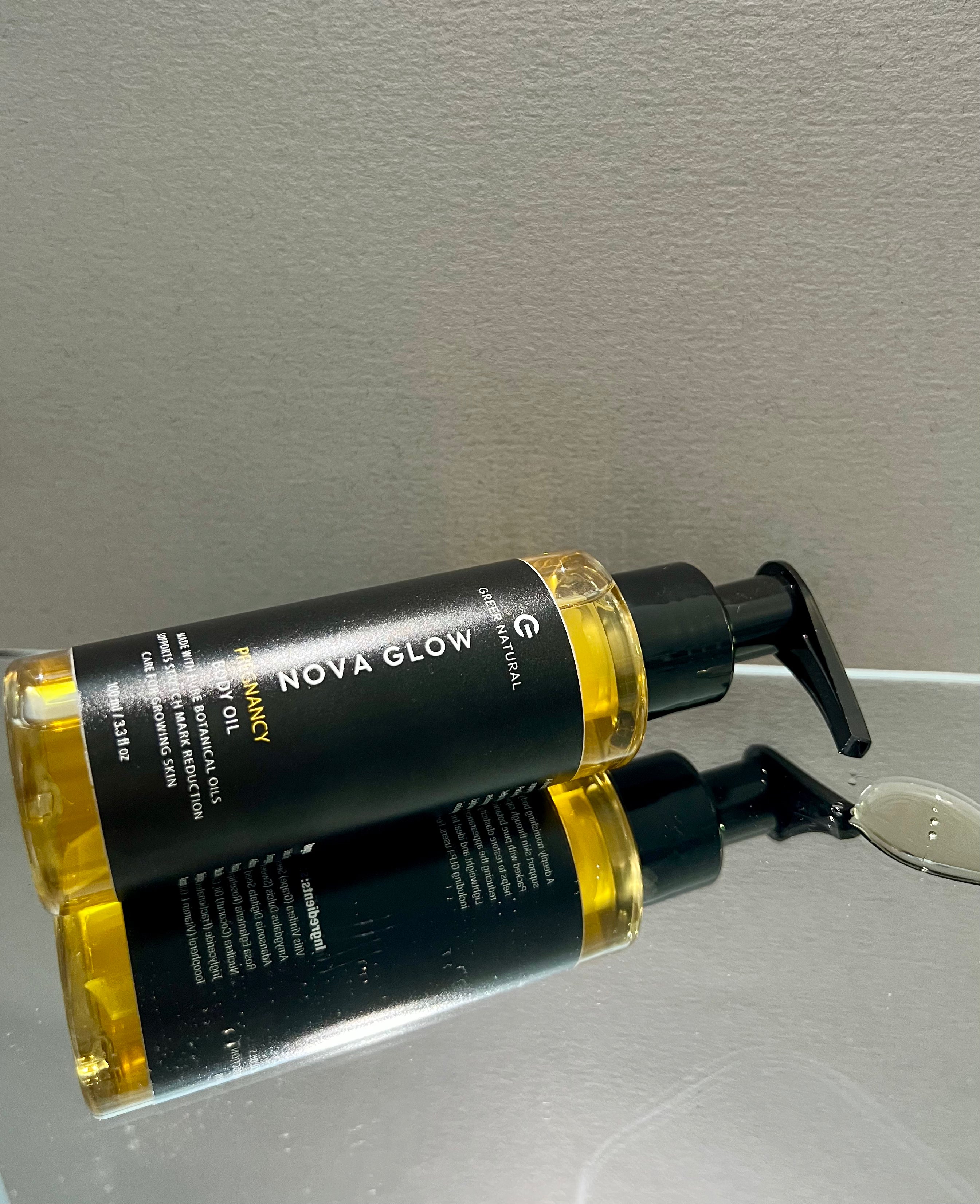 Bottles of Nova Glow product on a reflective surface with a neutral background