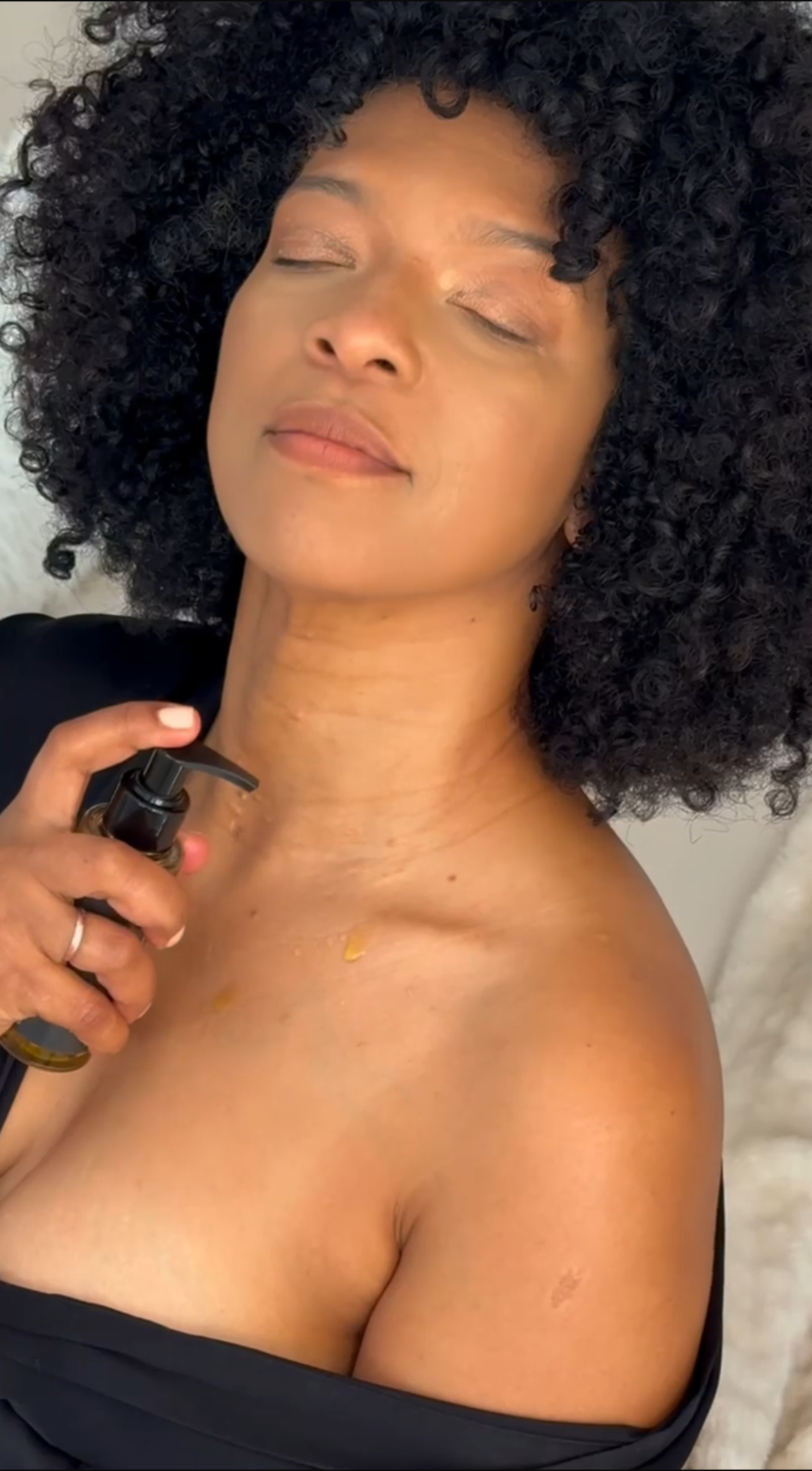 Woman using Novaglow body oil